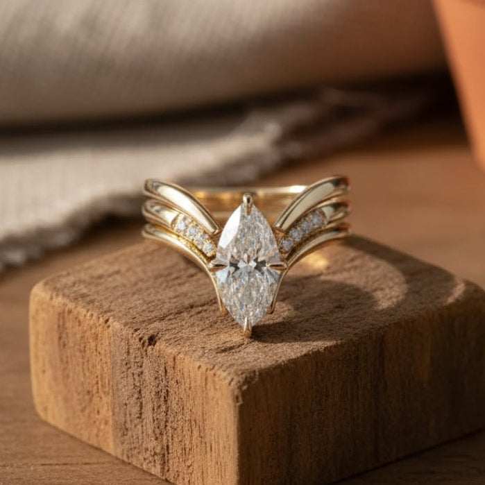Crown-Inspired Golden Ring with Flowing Drapes