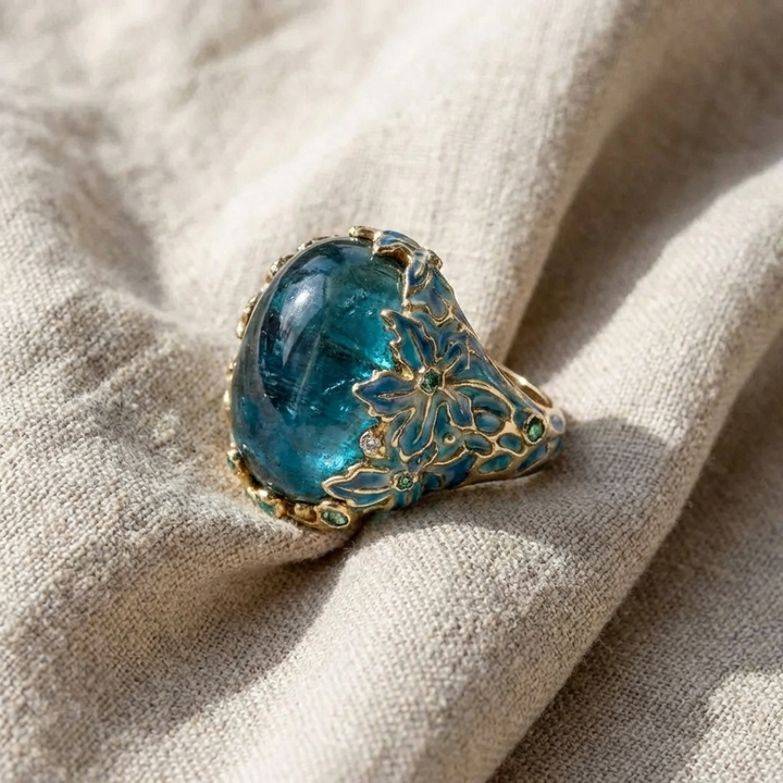 Sophisticated Gold Floral Ring with Blue Gemstone